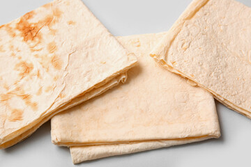 Fresh thin lavash on grey background