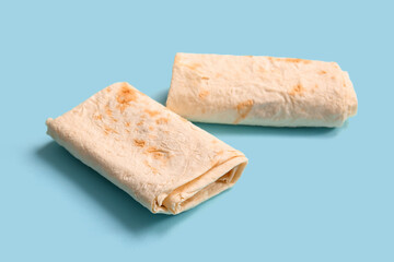Fresh thin lavash on blue background