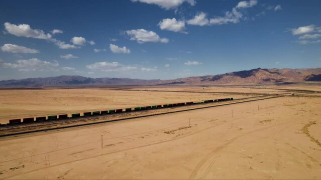 Landmarks of USA. Ghost city. Top cinematic aerial view of the abandoned cargo train in Bombay Beach, California USA. Drone footage. 