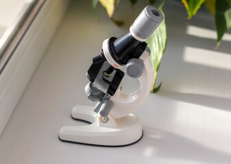 lose up shot of the microscope on the window. Science