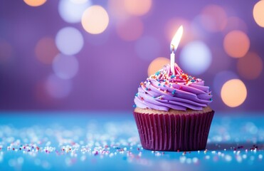 a red birthday cupcake with a candle in front of white circles