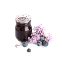 Jar of sweet jam, fresh blueberries and lilac flowers isolated on white background