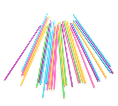 Different plastic straws on white background