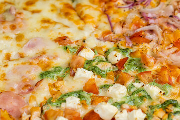 pizza using a large number of different ingredients close-up