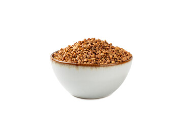 Raw buckwheat in a bowl isolated on a white background. Wheat grains, porridge, cereals, raw buckwheat in a plate. Healthy food. Porridge. Diet. Organic cerea