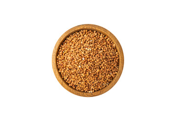 Raw buckwheat in a bowl isolated on a white background. Wheat grains, porridge, cereals, raw buckwheat in a plate. Healthy food. Porridge. Diet. Organic cerea