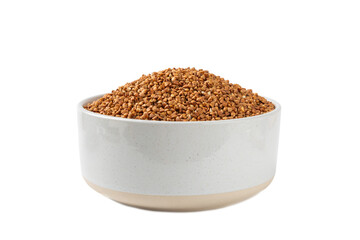 Raw buckwheat in a bowl isolated on a white background. Wheat grains, porridge, cereals, raw buckwheat in a plate. Healthy food. Porridge. Diet. Organic cerea