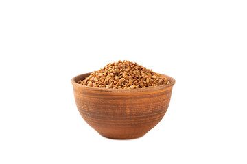 Raw buckwheat in a bowl isolated on a white background. Wheat grains, porridge, cereals, raw buckwheat in a plate. Healthy food. Porridge. Diet. Organic cerea
