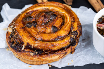 sweet delicious puff pastry with chocolate pieces in caramel