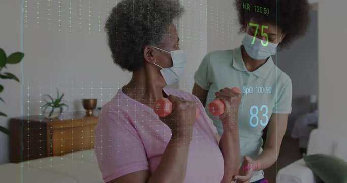 Animation of heart rate monitor over diverse female physiotherapist helping senior woman to exercise