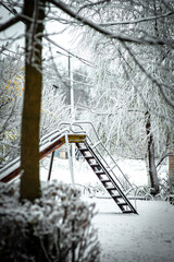 Street photography at winter . Snowy weather . Buildings in small town in Ukrain . Snow in the railway station. 