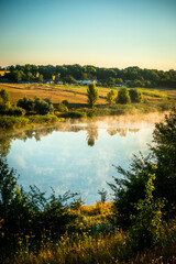 Lake in the morning . Fog on the lake at morning . Sunrise over the forest with fog . Summer vibes...