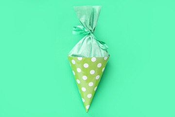 Beautiful school cone on green background