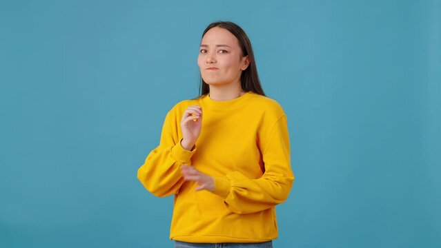 Indecisive woman dreaming and changing mind in blue studio