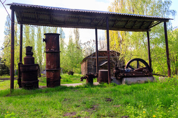 Old steaming threshing machine in Open air Museum of Folk Architecture and Folkways of Middle Naddnipryanschina in Pereyaslav, Ukraine
