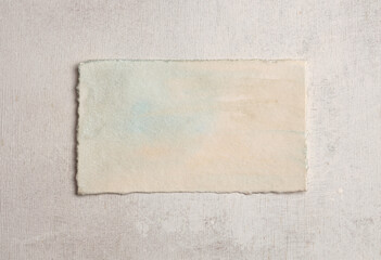 Beige frame painting paper empty card blank on wood wall. Abstract texture copy space neutral grunge background.