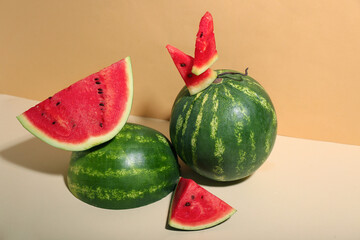 Fresh watermelons on beige table