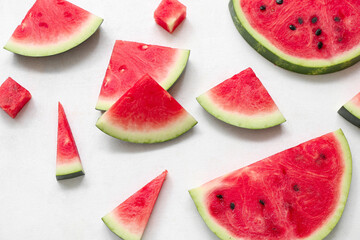 Pieces of fresh watermelon on white background