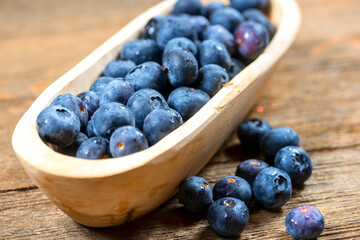 Wooden Bowl of Fresh Blueberries, Nutritious Fruit in Small Bowl