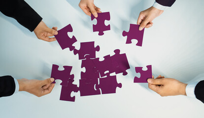 Top view panorama banner of business team assembling jigsaw puzzle over table symbolize business partnership and collective teamwork for HR recruitment and job seeker background. Shrewd