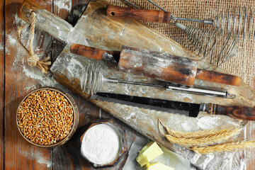 The process of kneading dough in the kitchen. Eggs, flour and other ingredients on the kitchen table in a composition.