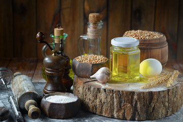 Kneading dough with flour and eggs, on an old background