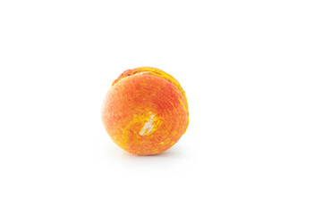 Orange French macaroon isolated on white background. Tasty colorful macaroons. French pastry, almond cookies from egg whites. Culinary and cooking concept.