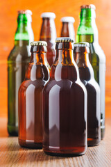 Bottles of beer on wooden table.