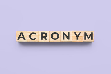 acronym wooden cubes on purple background