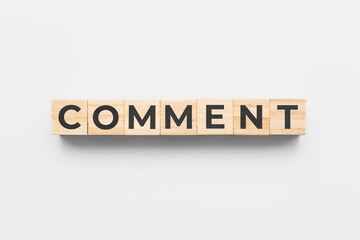 comment wooden cubes on white background