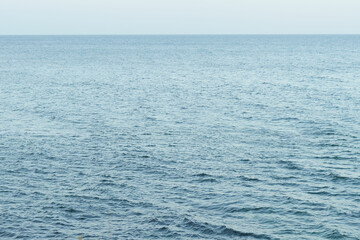 Blue sea or ocean view with horizon and sky. Sea water texture, weather forecast. Background for your design