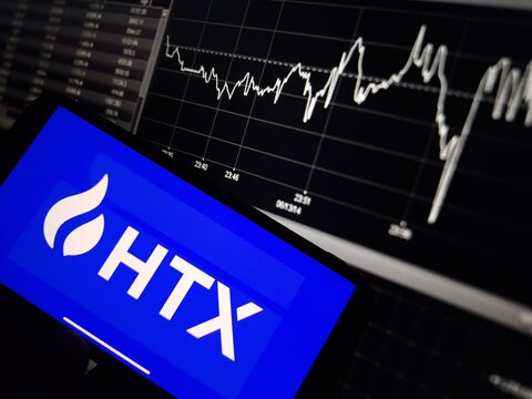 Konskie, Poland - January 10, 2024: HTX cryptocurrency exchange logo displayed on smartphone on crypto market data background