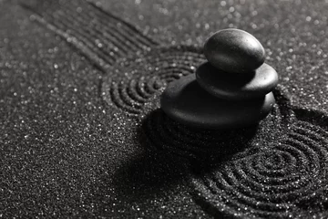 Foto auf Acrylglas Stack of stones on dark sand with lines. Zen concept © Pixel-Shot