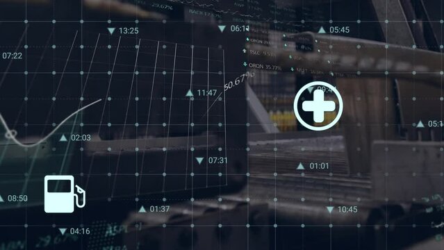 Animation of data processing and energy icons over machinery in factory