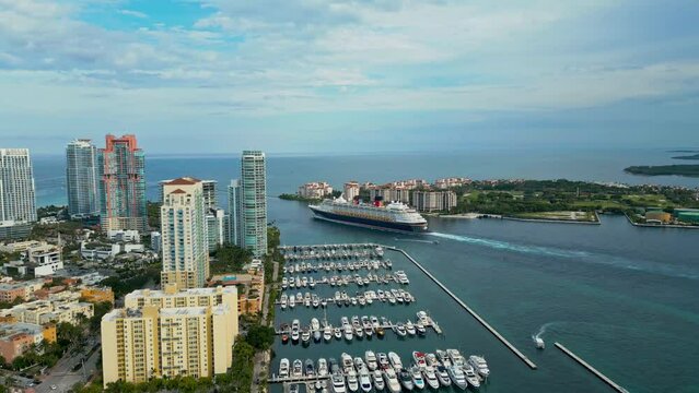 Aerial Drone view Miami Marine. Tropical paradise in Biscayne Bay. Marina with yachts and boats. Miami Marine port in Florida. Aerial View of Marina with boats in Biscayne Bay, Miami.