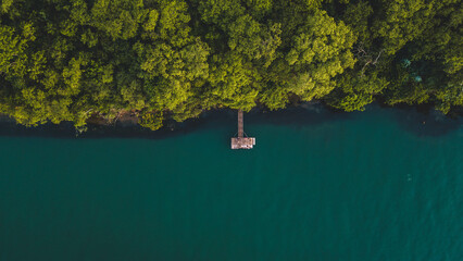 aerial view of a wooden jetty in the Parana River or Rio Parana, the second bigger river of Brazil....