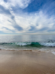 Beach and sea with blue sky and cloudscape © Veronika Z. Gaudet
