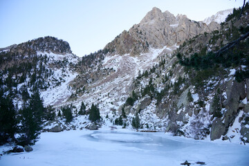 Idyllic frozen lake surrounded by snowy peaks