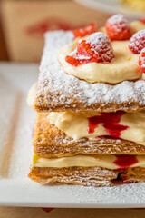 Delicious looking Millefeuille with pastry cream and raspberry