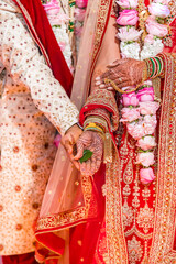 Indian Hindu wedding ceremony ritual items and hands close up