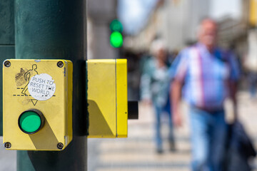 Pedestrian crossing button on the crosswalk with the information, 