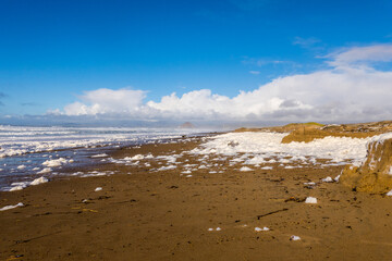 Sea foam on the beach