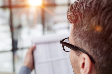 freelancer reading the proposal of a project, financial deal or report