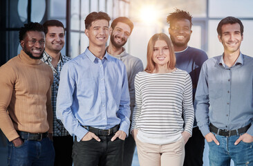 Successful business team smiling while standing in the office