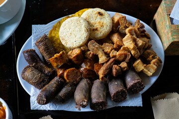 delicious sausage platter with pork cracklings at a latin restaurant in colombia