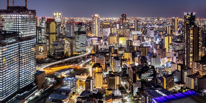 Osaka city from above with the skyline skyscrapers panorama at night in Osaka, Japan, Asia