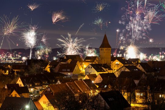 Fireworks on New Year's Eve, view of Korb-Steinreinach in the Rems valley, church tower, Rems-Murr district, Baden-Wuerttemberg, Germany, Europe
