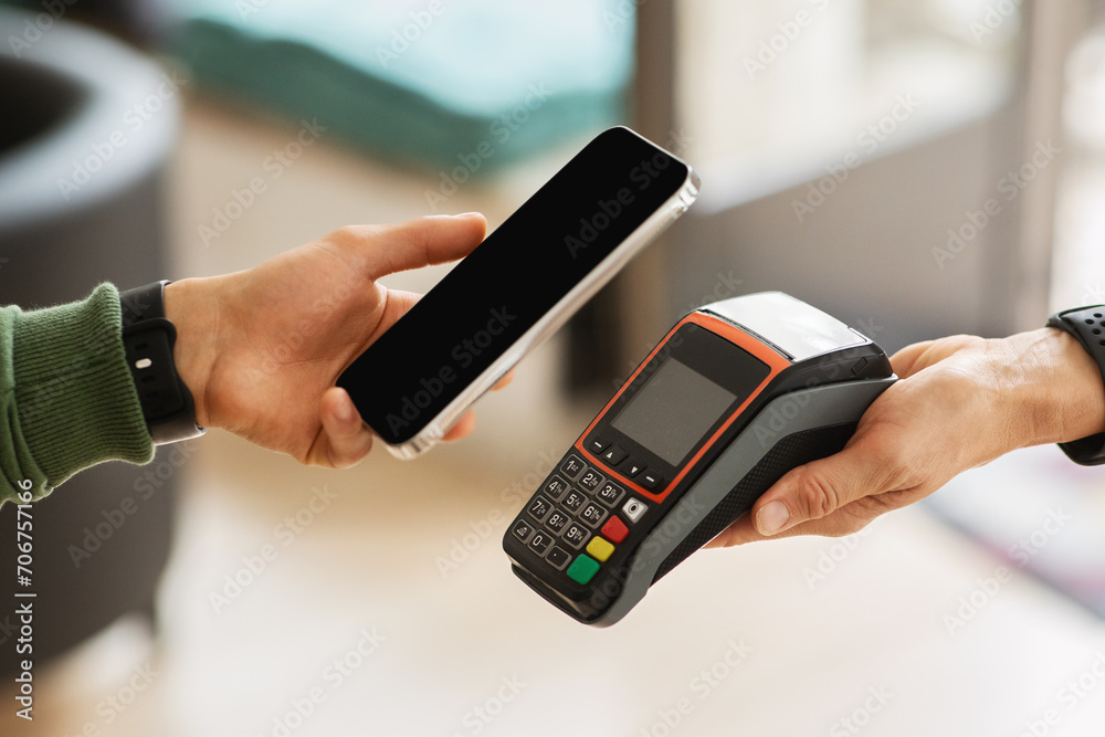 Poster Customer using mobile bank app for payment at cafe