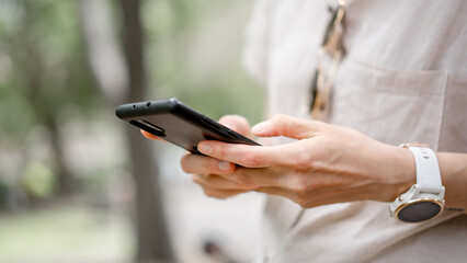 Social life, Happy relaxed young woman sitting on couch using cell phone, smiling lady holding smartphone, looking at cellphone enjoying online ecommerce shopping in mobile apps or watching videos.