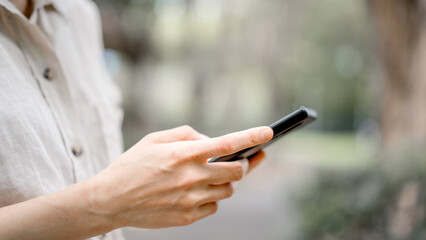 Social life, Happy relaxed young woman sitting on couch using cell phone, smiling lady holding smartphone, looking at cellphone enjoying online ecommerce shopping in mobile apps or watching videos.